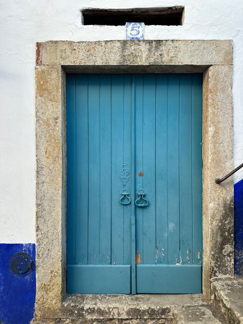 Rustic blue door symbolizing exclusive entry